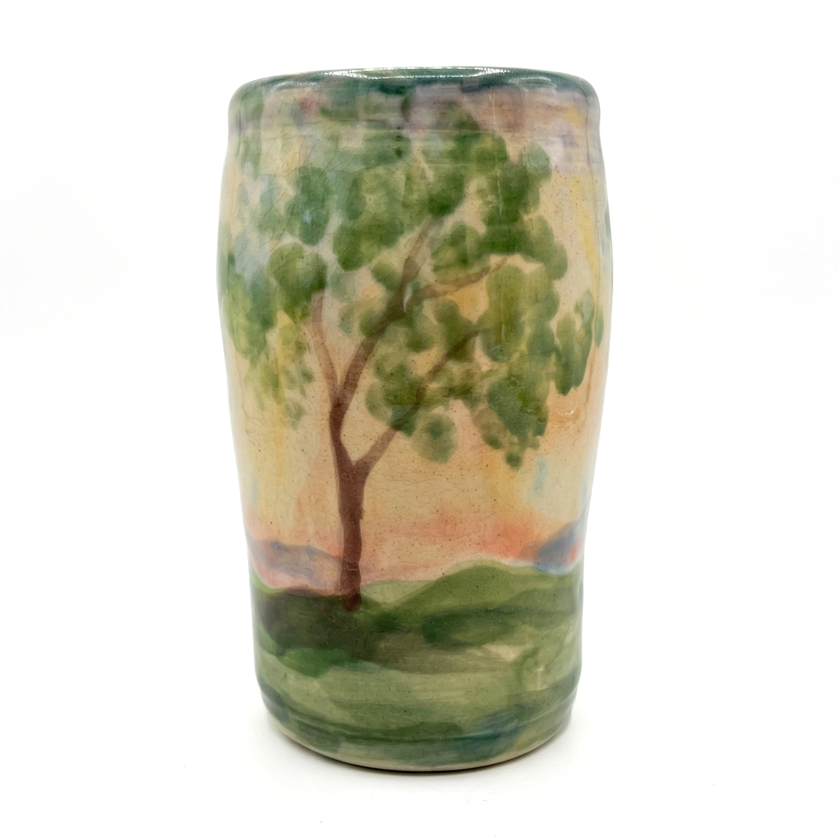 Handmade vase with green hillside tree landscape