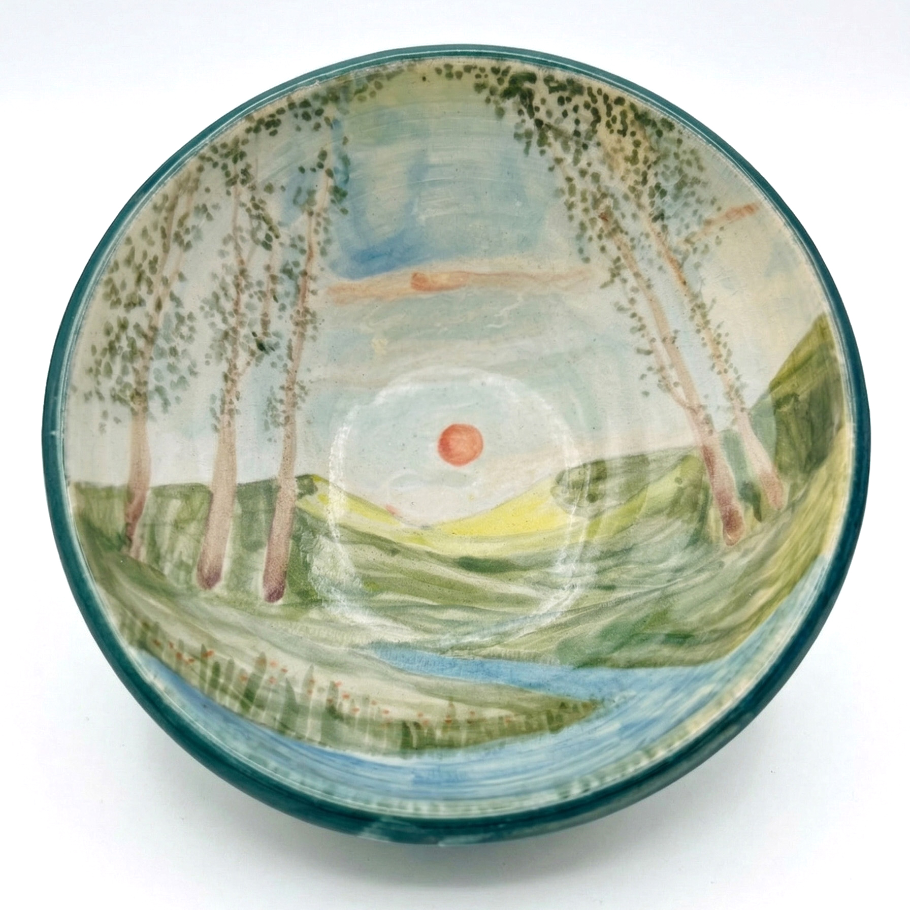 Handmade bowl with painted meadow and sunset landscape